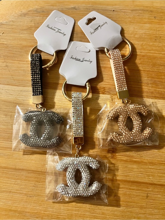 Fashion Jewelry Accessories - Fashion Jewelry Crystal Logo Bag or Keychain - Silver, Gold, or Black.
